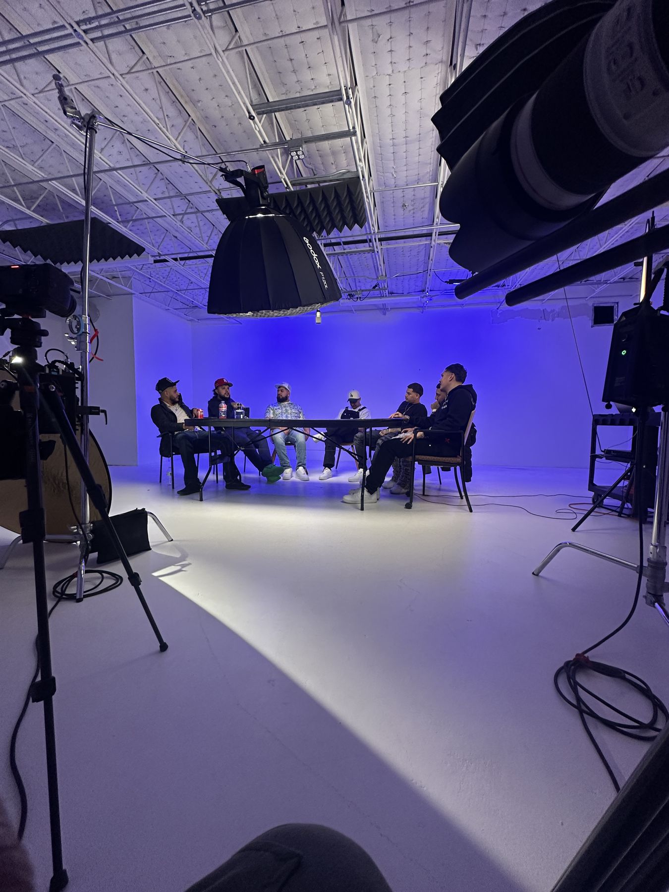 Panel discussion lit in blue